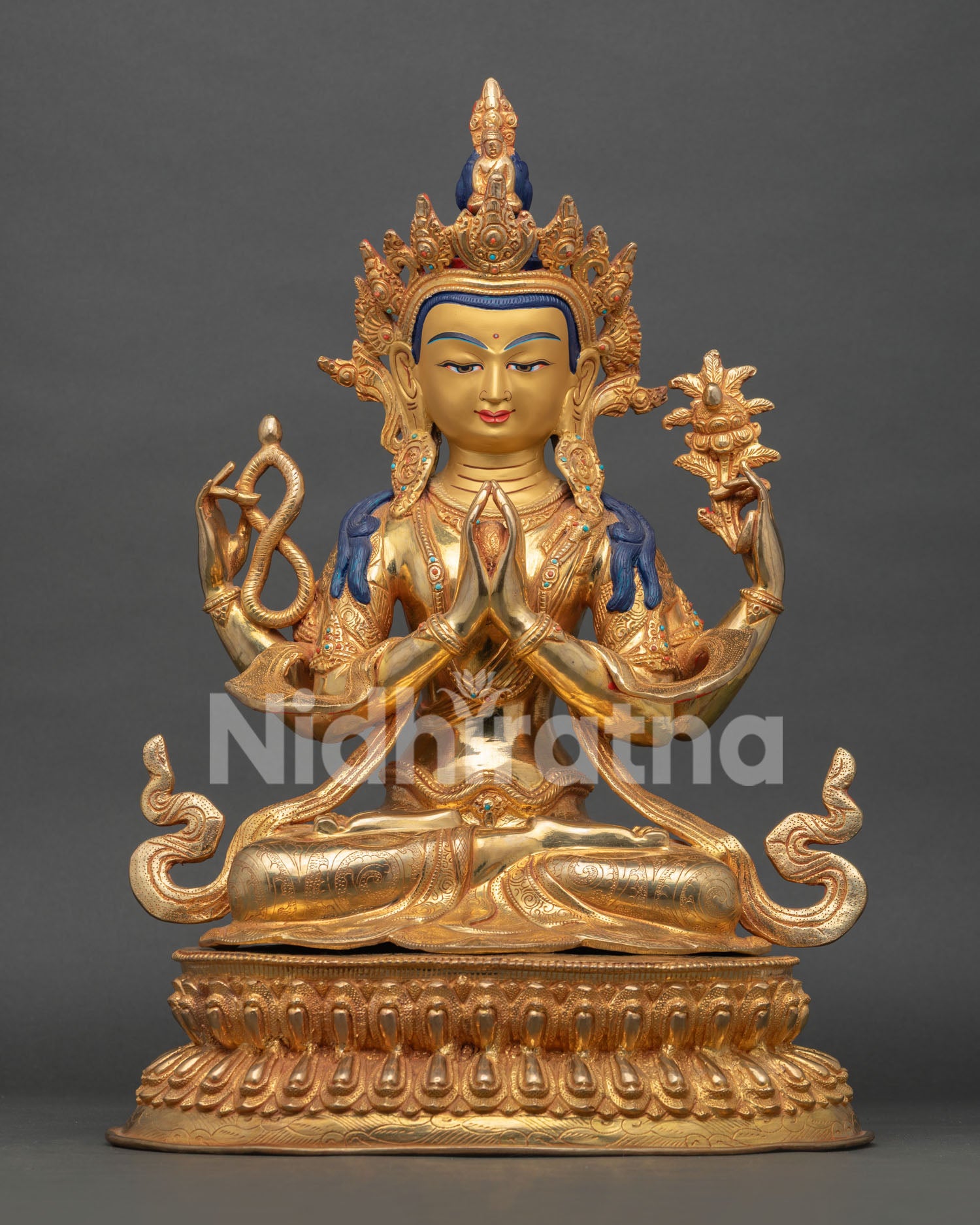 Front view of Four Armed Chenrezig statue handcrafted from copper with gold fire gilding and gold painted face