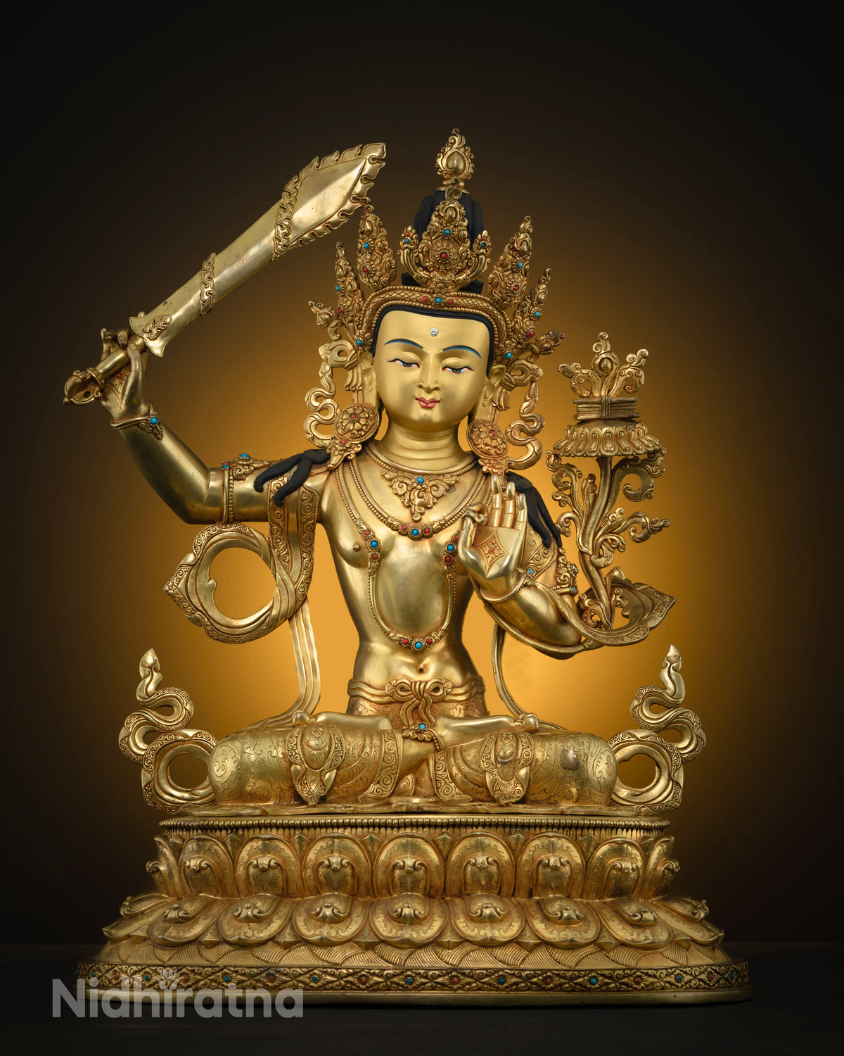 Front view of gold fire-gilded copper Bodhisattva Manjushri statue with raised sword on lotus throne