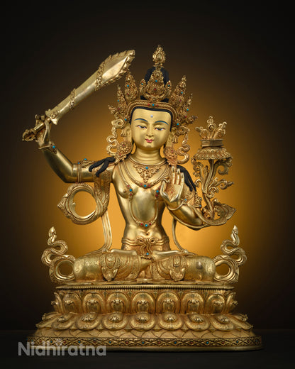 Front view of gold fire-gilded copper Bodhisattva Manjushri statue with raised sword on lotus throne
