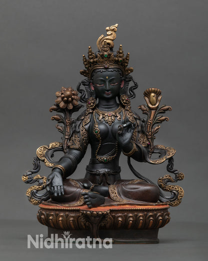 Front view of Green Tara statue handcrafted in Nepal from solid copper with hand painted acrylic colors and ornate lotus seat.