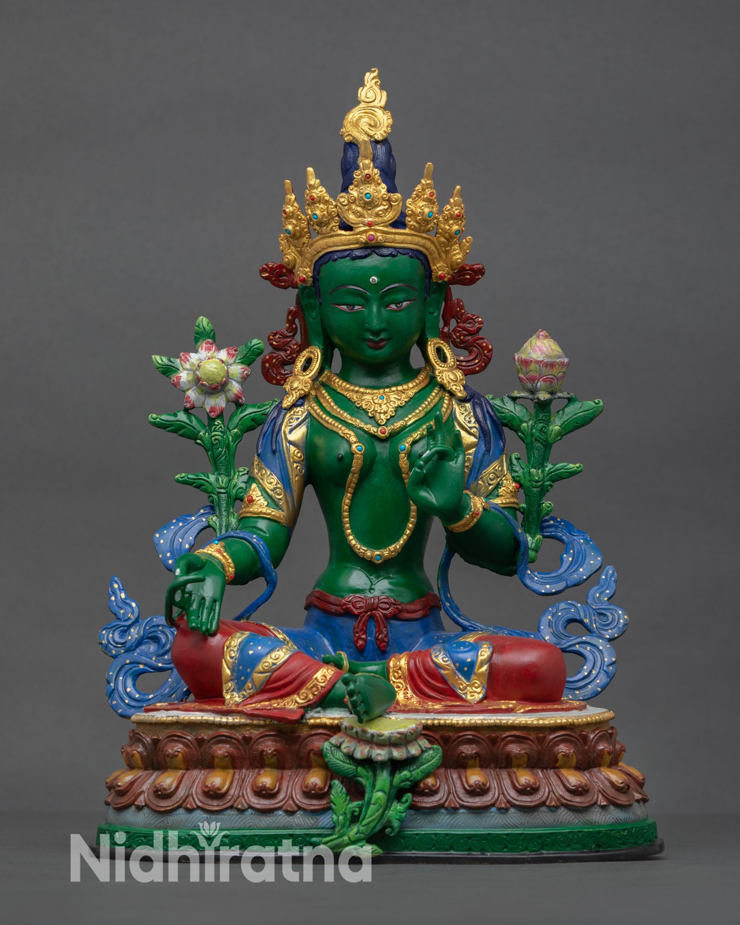 Front view of Green Tara statue handcrafted in Nepal in solid copper with hand painted acrylic finish and gold gilded details