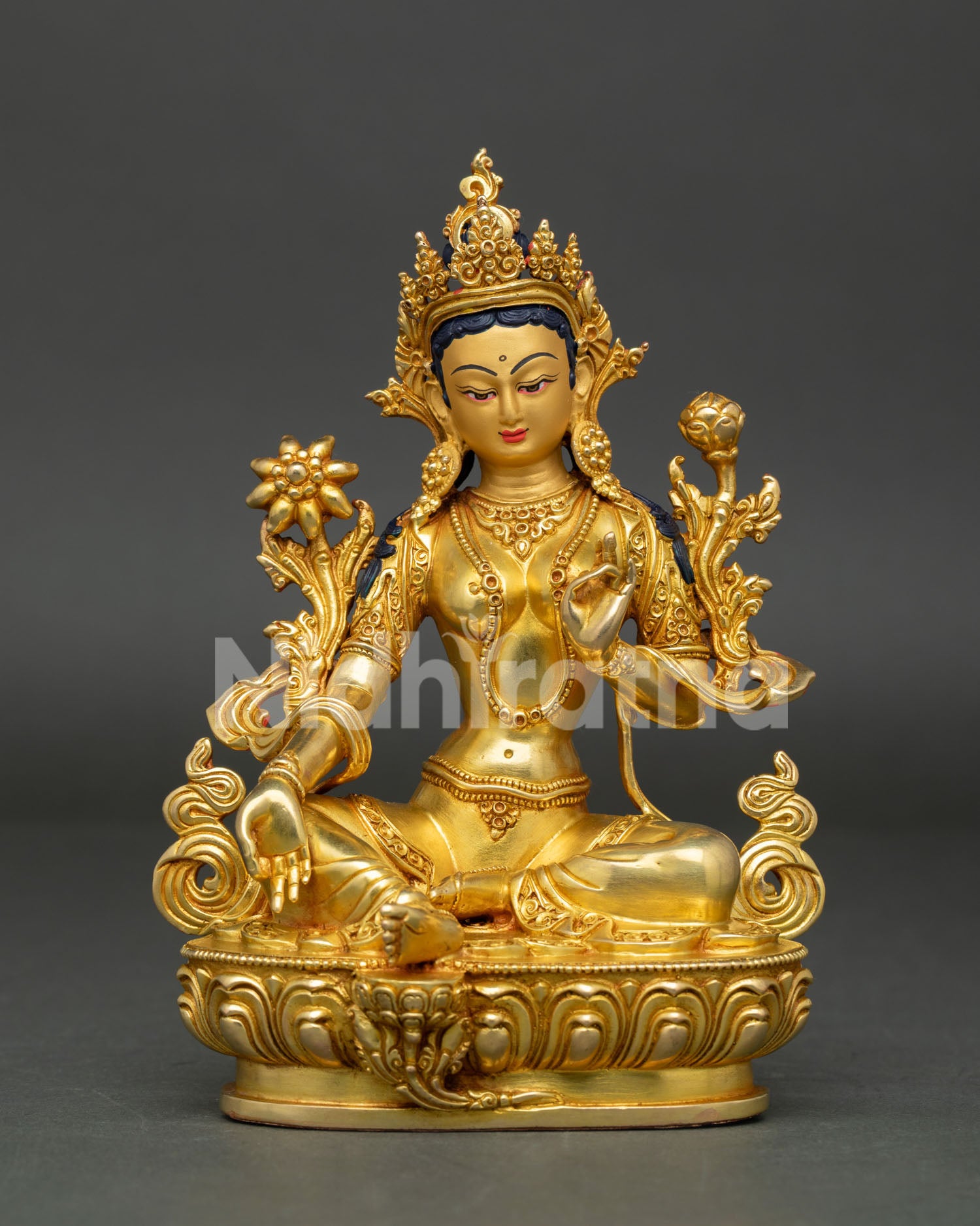 Front view of Green Tara statue, handcrafted in Nepal with 24K gold gilding and serene gold painted face