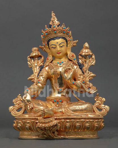 Front view of Green Tara statue handmade in copper with gold finish and semi precious stones from Nepal