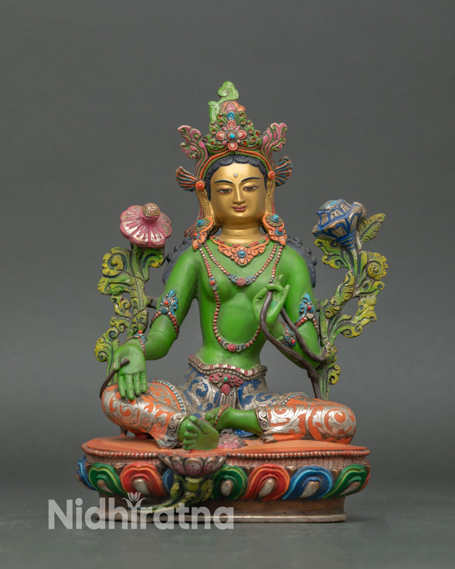 Front view of Green Tara statue handmade in Nepal with copper body, 24K gold painted face and vibrant hand painted acrylic colors with semi precious stones