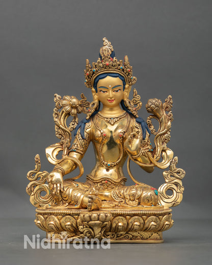 Front view of Green Tara statue handmade in Nepal with gold fire gilded copper, lotus seat, and serene expression for spiritual home decor