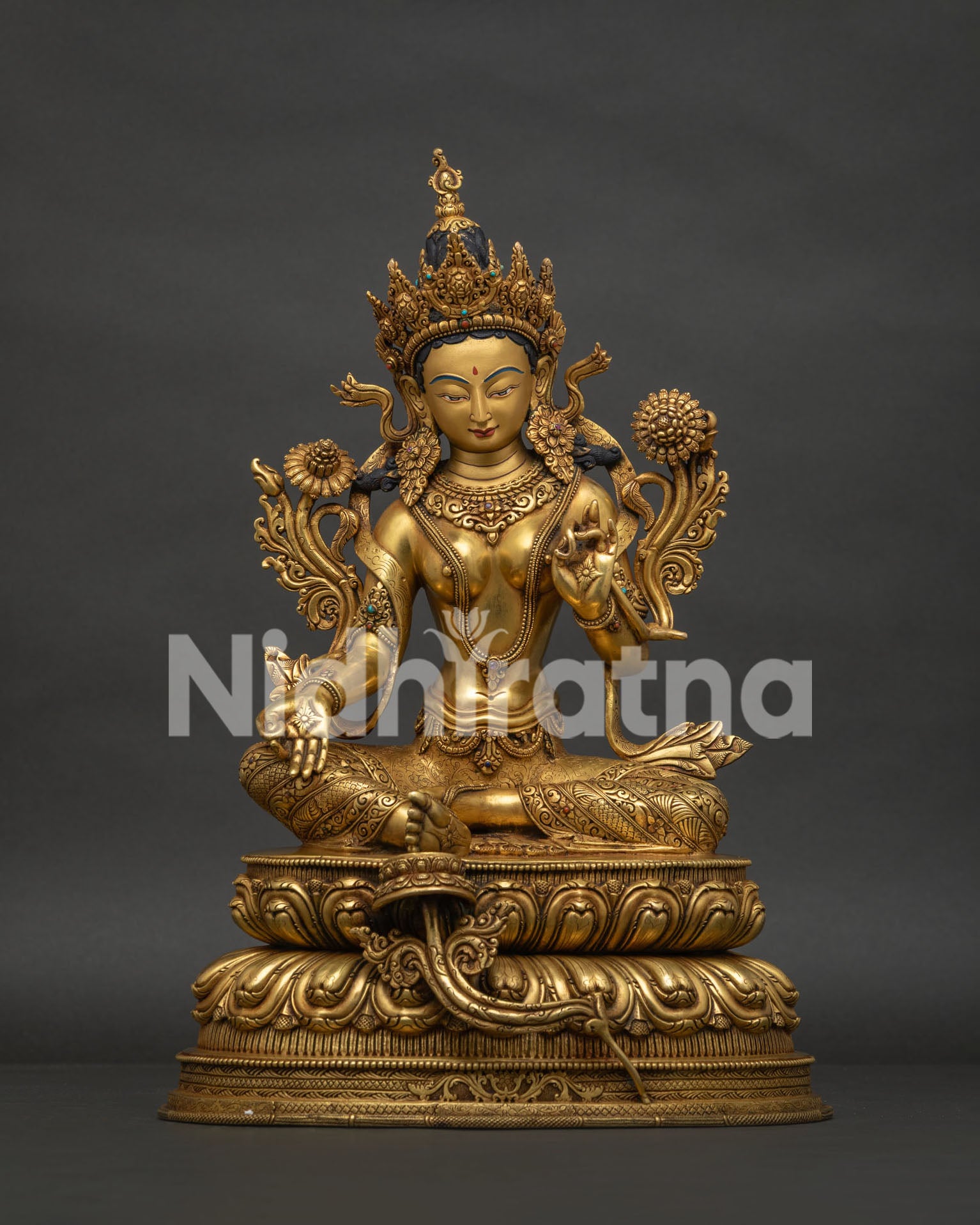 Front view of Green Tara statue with gold gilded copper and Himalayan craftsmanship