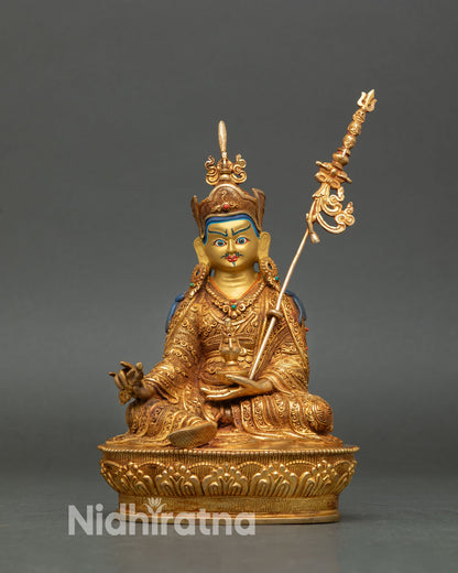Front view of Guru Rinpoche statue handcrafted in Nepal pure copper gold gilded with semi precious stones
