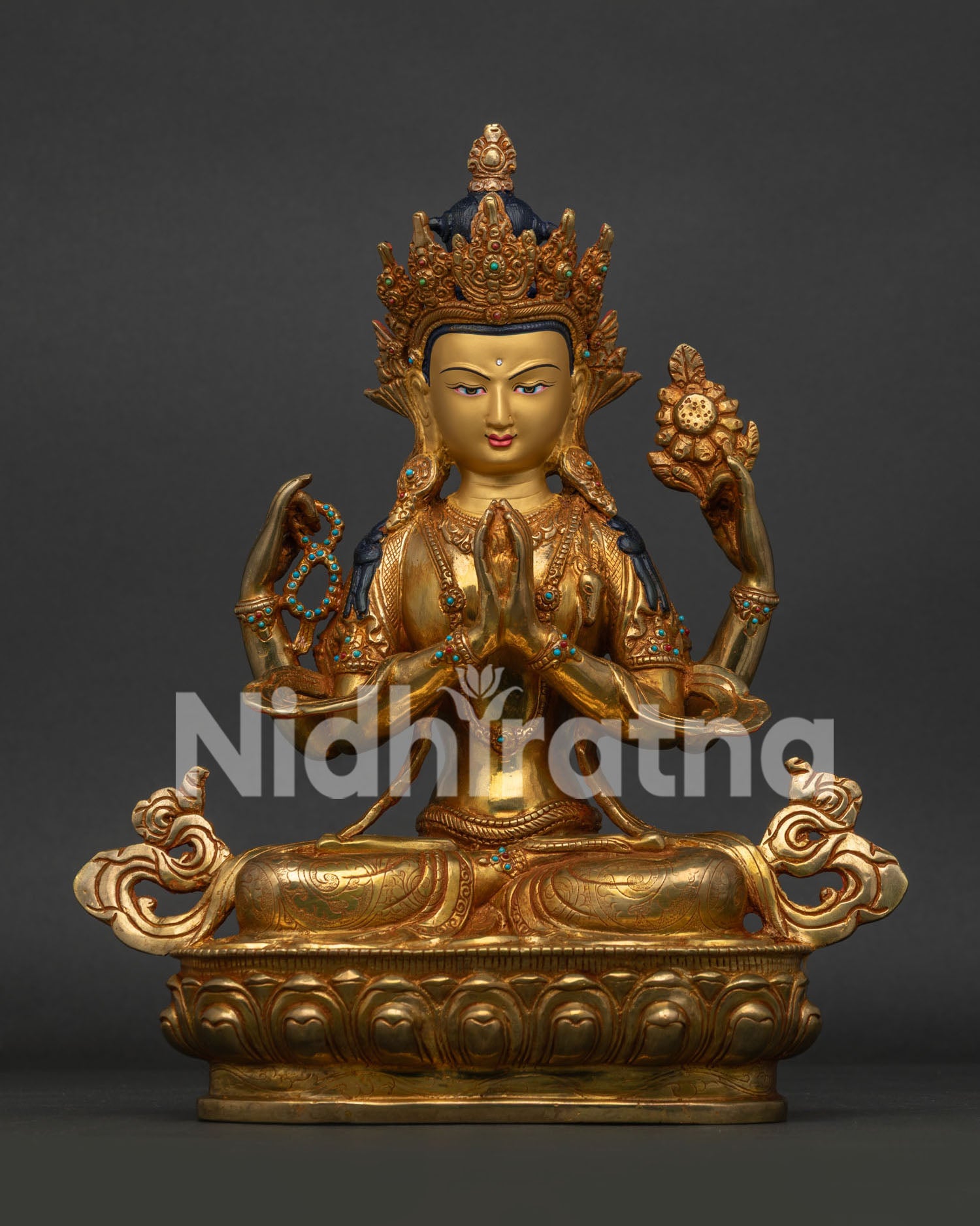 Front view of handcrafted Chenrezig Statue with 24K gold gilding on lotus throne