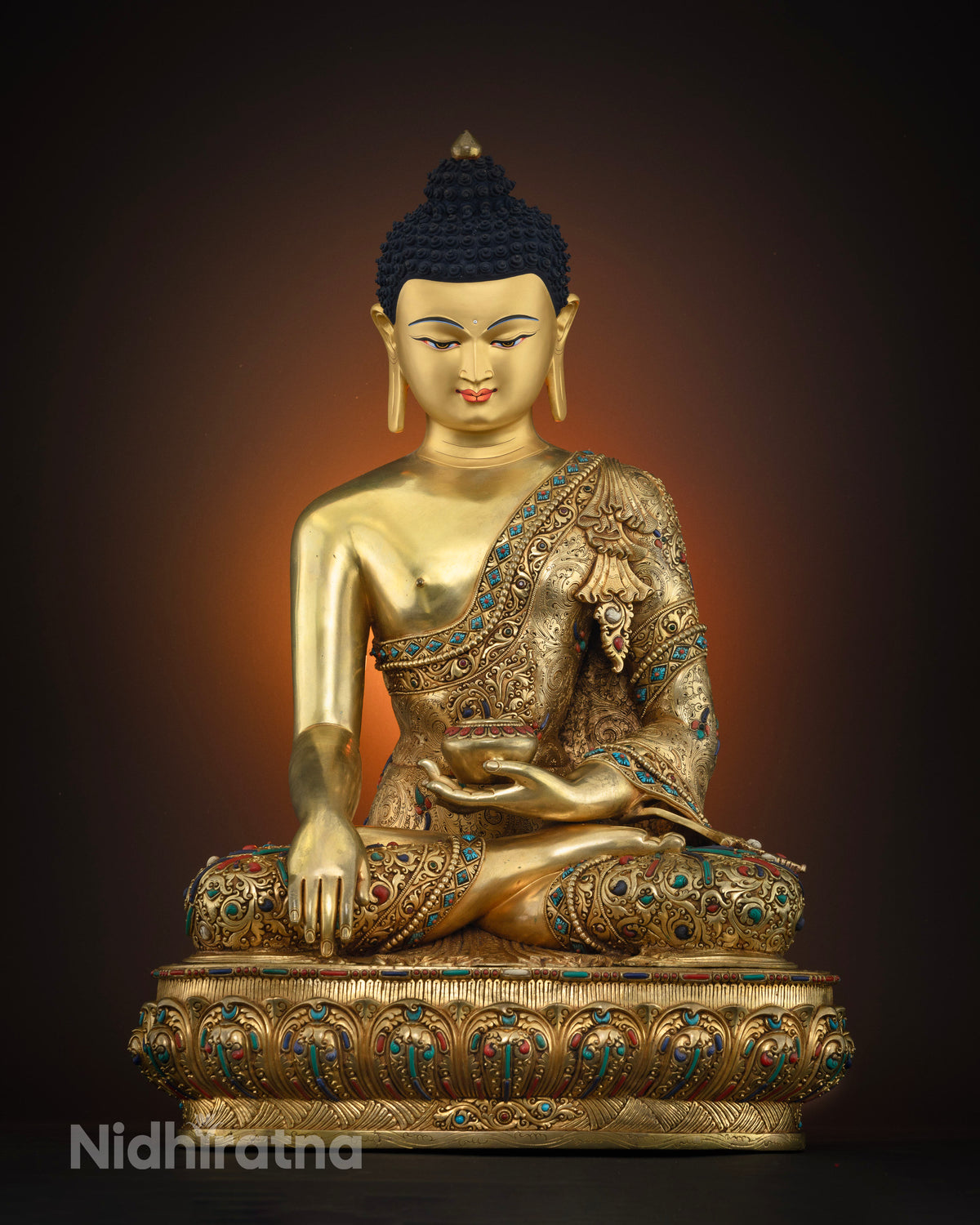 Front view of handcrafted copper Shakyamuni Buddha statue with gold fire-gilding