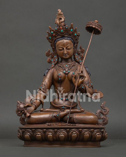 Front view of Handcrafted Dukar statue, Sitatapatra Goddess of Protection with oxidized copper 