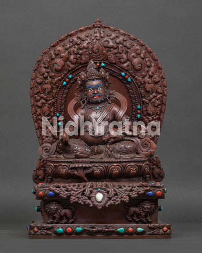 front view of handcrafted Dzambhala statue in oxidized copper with turquoise and coral inlays