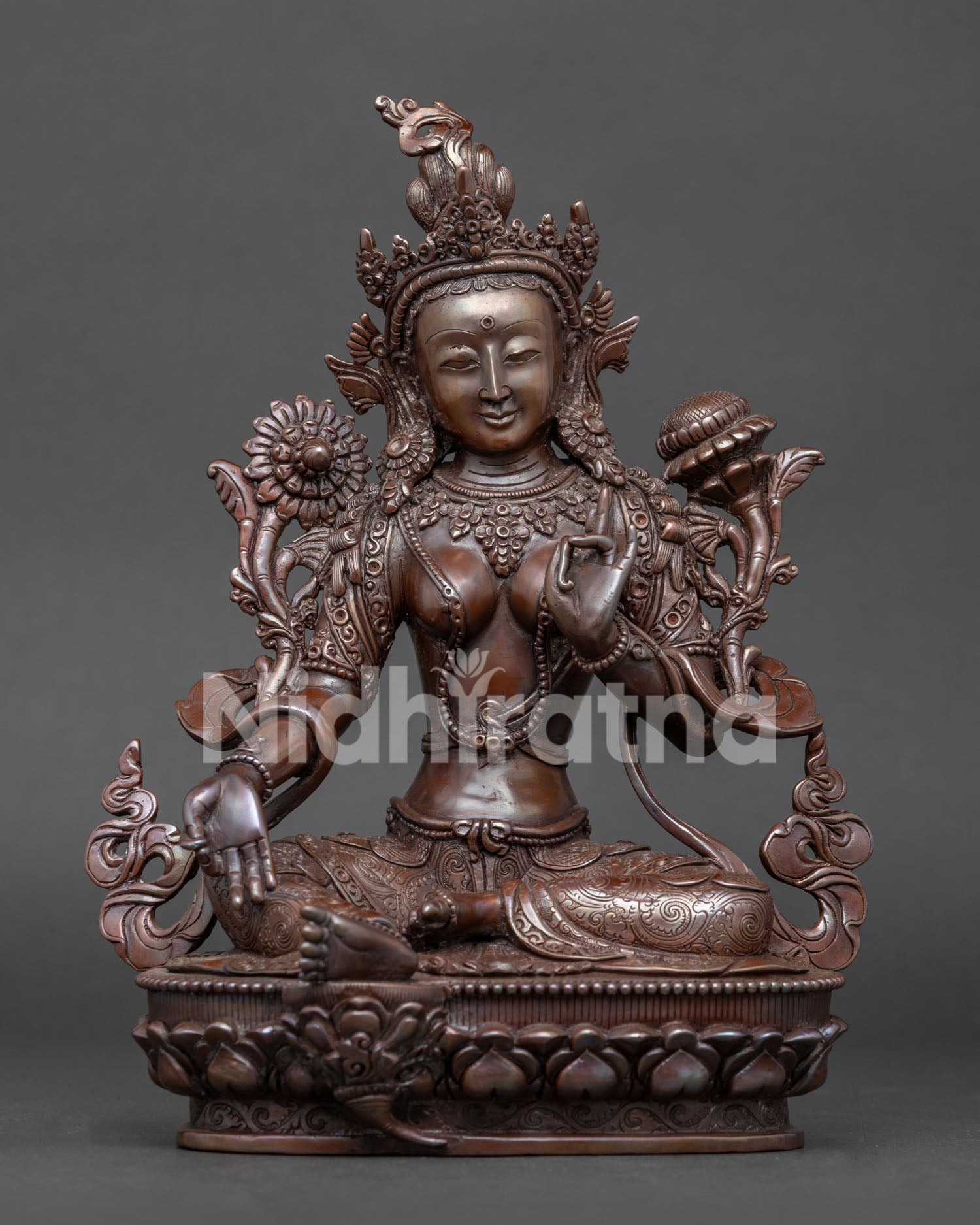 Front view of handcrafted Green Tara statue in oxidized copper from Nepal