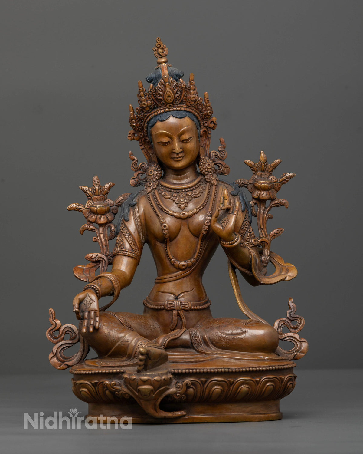 Front view of handcrafted Green Tara statue in pure copper with chemically oxidized finish