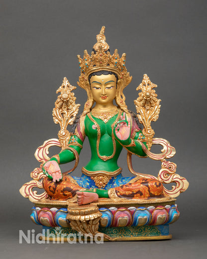Front view of handcrafted Green Tara statue with copper body, lotus pedestal, and gold-gilded ornaments
