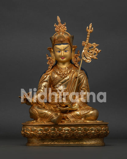 Front view of handcrafted Guru Rinpoche Statue with 24K gold fire gilding on lotus pedestal