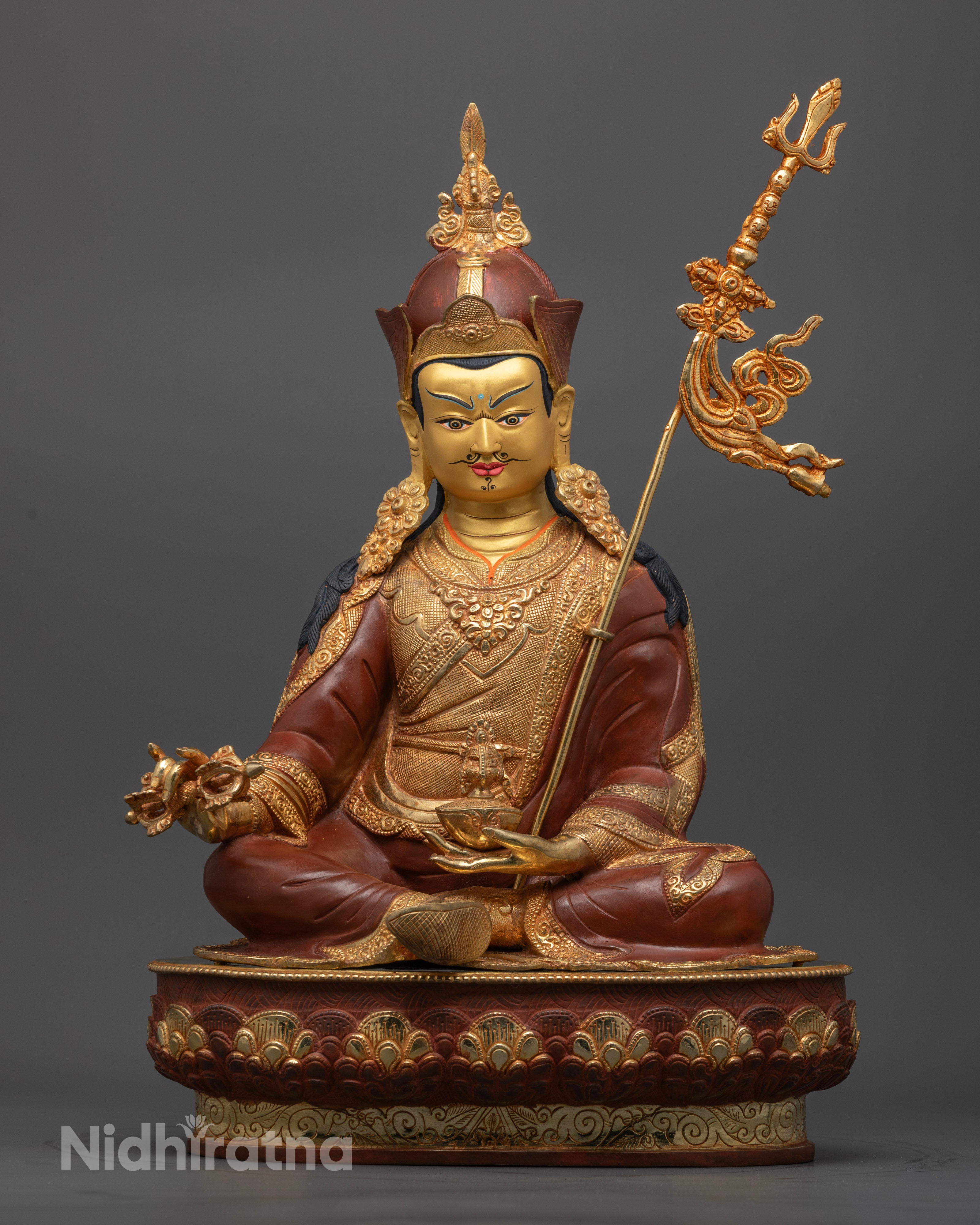 Front view of handcrafted Guru Rinpoche Statue with oxidized copper and gold gilded finish