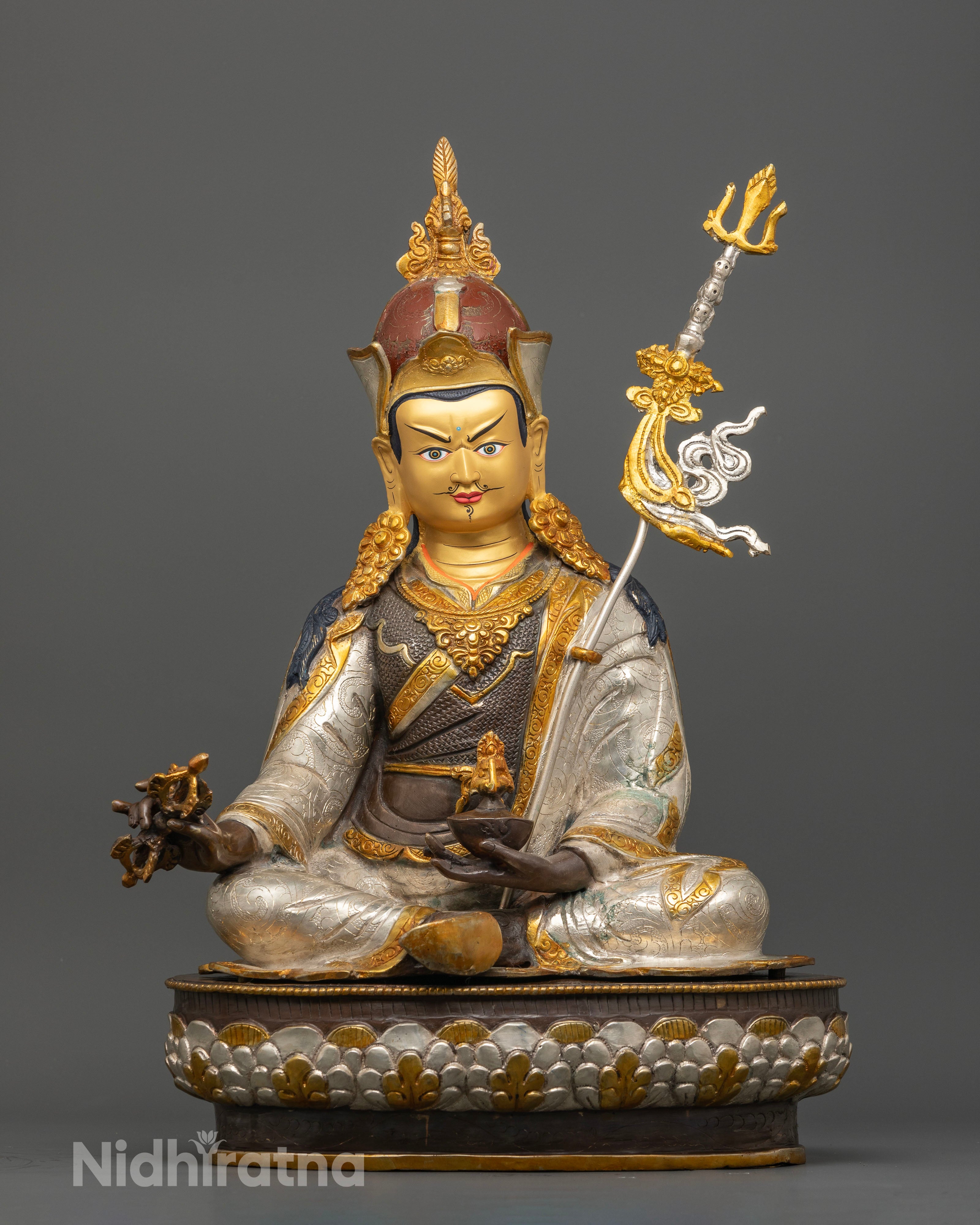 Front view of handcrafted Guru Rinpoche Statue with oxidized copper finish and silver-plated, gold gilded details