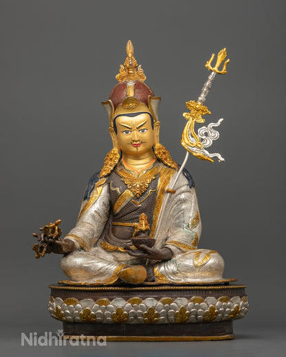 Front view of handcrafted Guru Rinpoche Statue with oxidized copper finish and silver-plated, gold gilded details