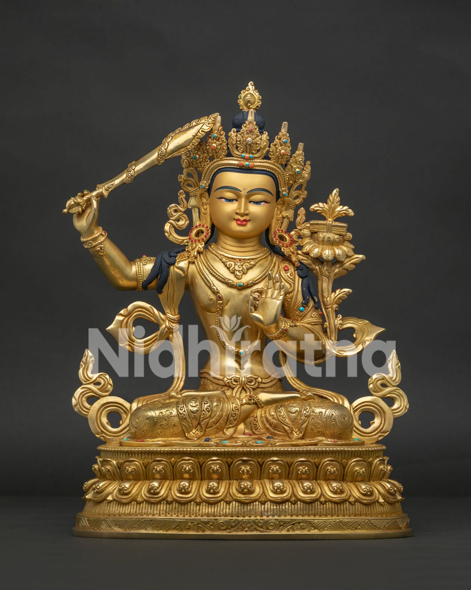 Front view of handcrafted Manjushri Statue with 24K gold finish and semi precious stones