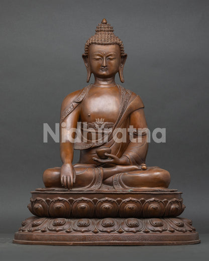 Front view of handcrafted Shakyamuni Buddha statue in Bhumisparsha mudra, oxidized copper, Nepal