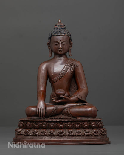 Front view of handcrafted Shakyamuni Buddha statue in oxidized copper