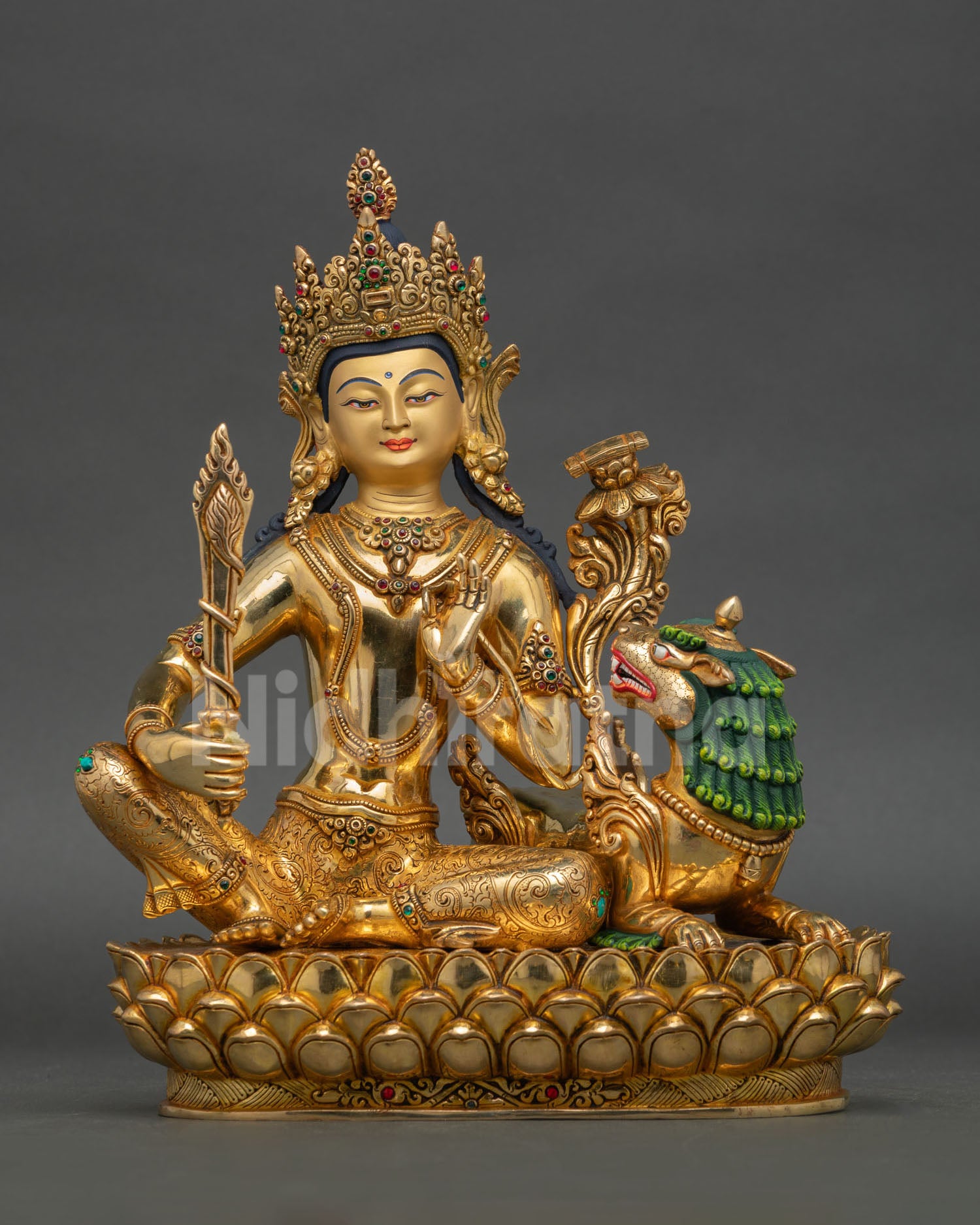 Front view of handcrafted Simhanada Manjushree statue made in Nepal using lost wax casting with gold fire gilding jeweled crown and sacred Buddhist ornaments