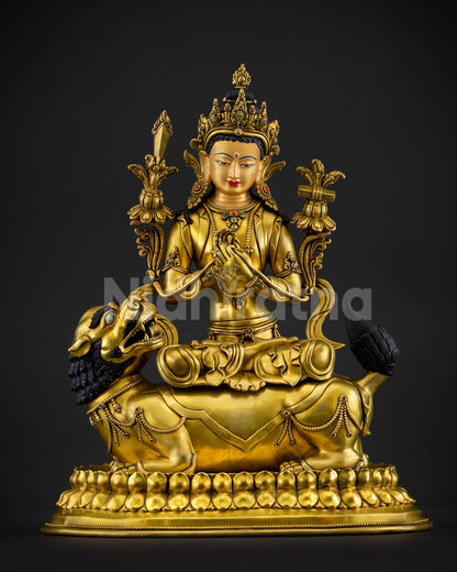 Front view of handcrafted Simhanada Manjushri statue from Nepal in gold gilded copper with roaring lion throne flaming sword of wisdom