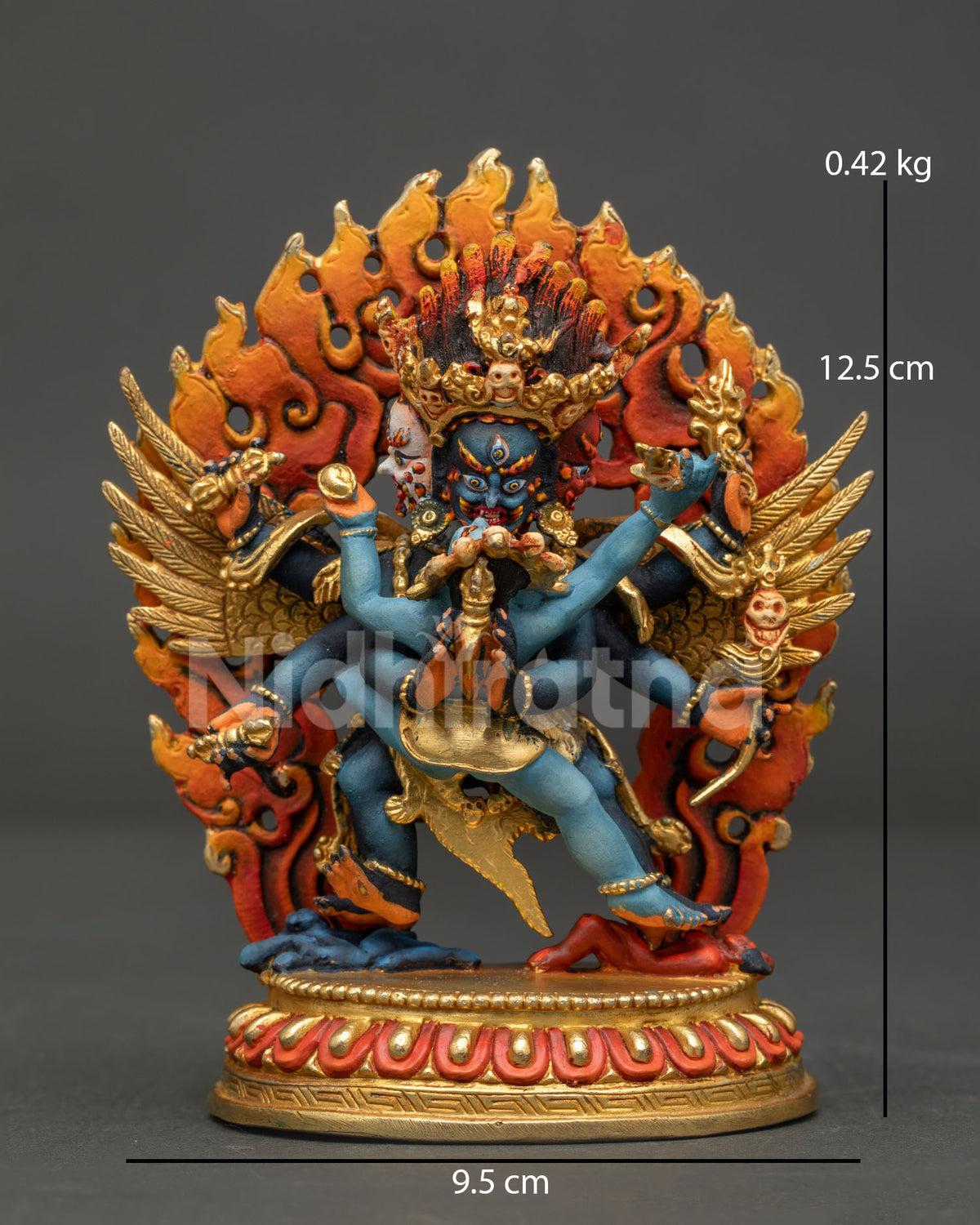 Front view of handcrafted Vajrakilaya Dorje Phurba statue with gold gilding and flame halo from Nepal