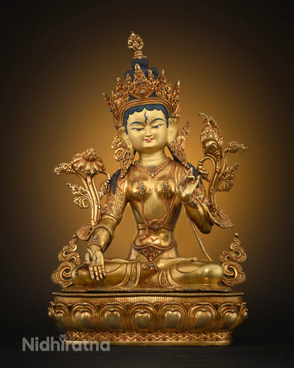 Front view of handcrafted White Tara Buddhist statue in 24K fire-gilded copper on lotus base