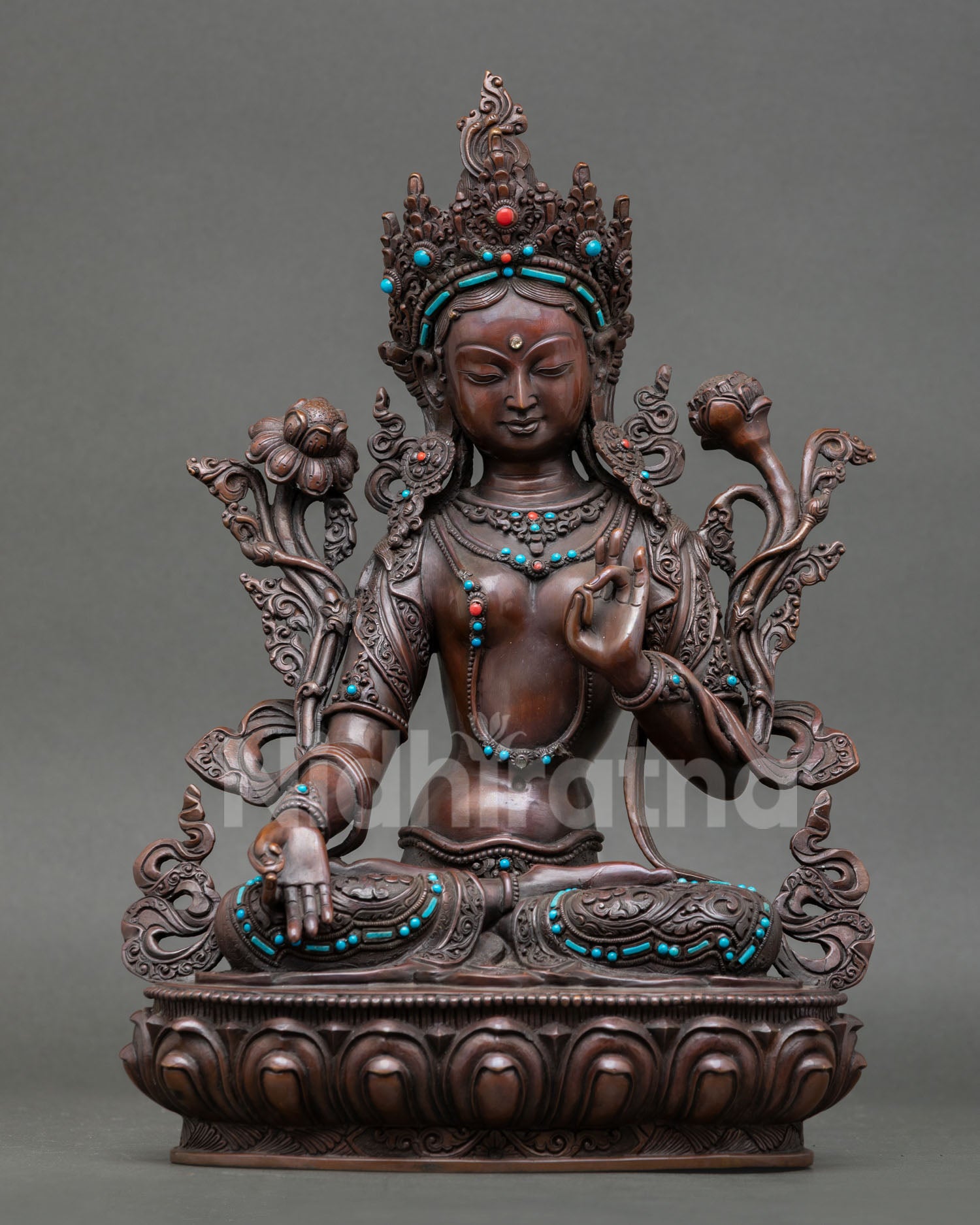 Front view of handcrafted White Tara Saptalocana statue from Nepal in oxidized copper with turquoise and coral stones seated on lotus pedestal