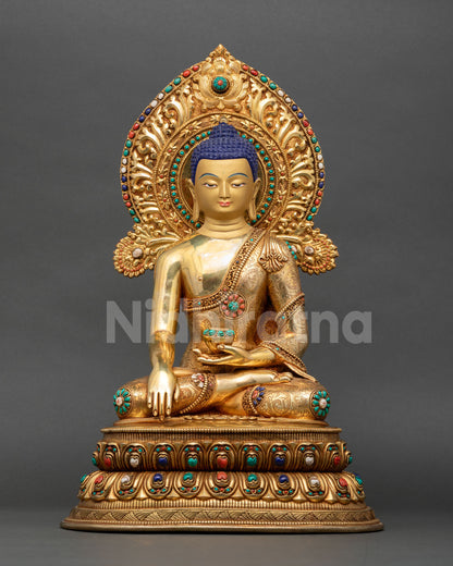 Front view of handmade Buddha Shakyamuni statue with 24K gold gilding, Earth Touching Mudra, and ornate halo crafted by Newari artisans in Nepal.