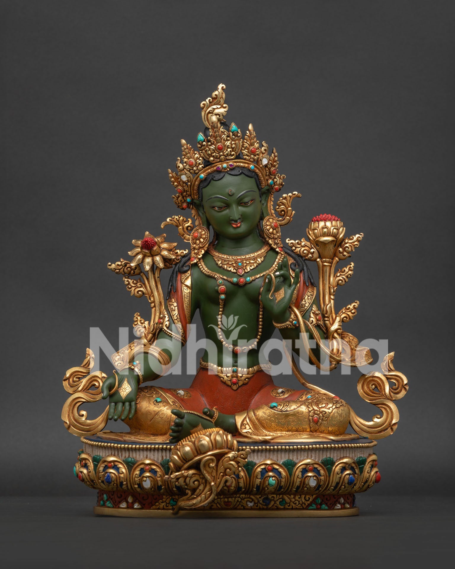 Front view of handmade Green Tara statue in copper with gold gilding from Nepal.