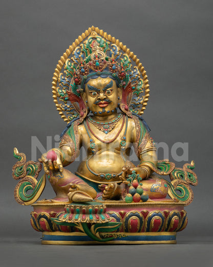 Front view of handmade Tibetan Yellow Dzambhala statue with gold gilded antique finish