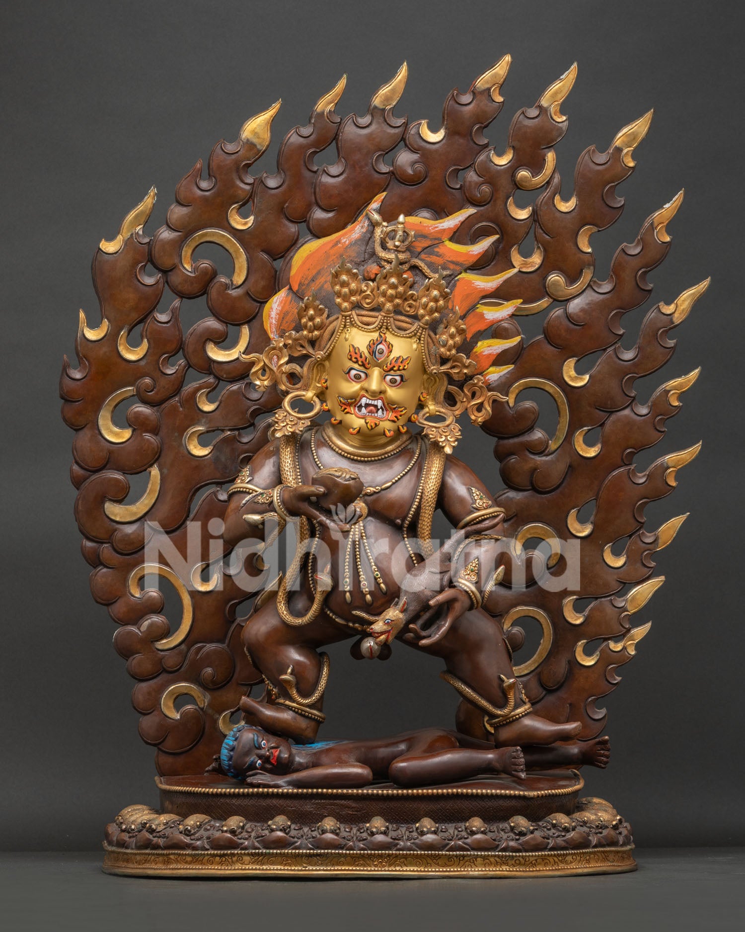 Front View of Large Black Dzambhala Statue with Oxidized Copper Finish and Gold Painted Face