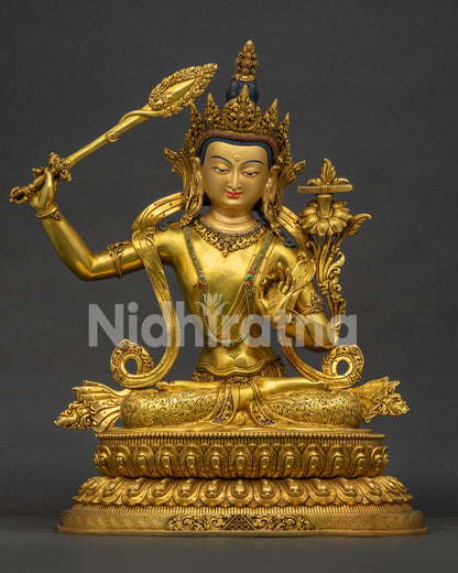 Front view of large gold-gilded Manjushri statue handcrafted in Nepal