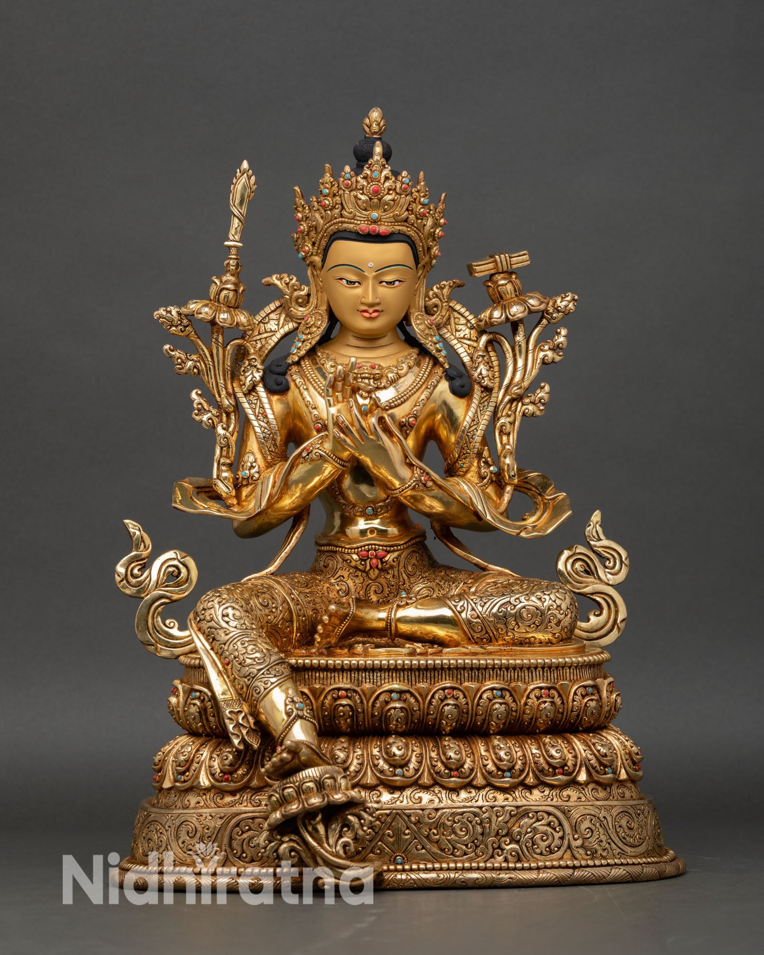 Front view of Manjushri Bodhisattva statue handcrafted in Nepal, copper with 24K gold-gilded face and fire-gilded finish, Wisdom Deity sculpture
