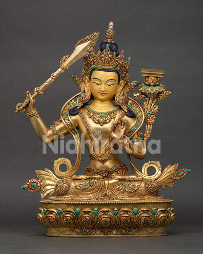 Front view of Manjushri Bodhisattva statue holding wisdom sword and lotus scripture from Nepal