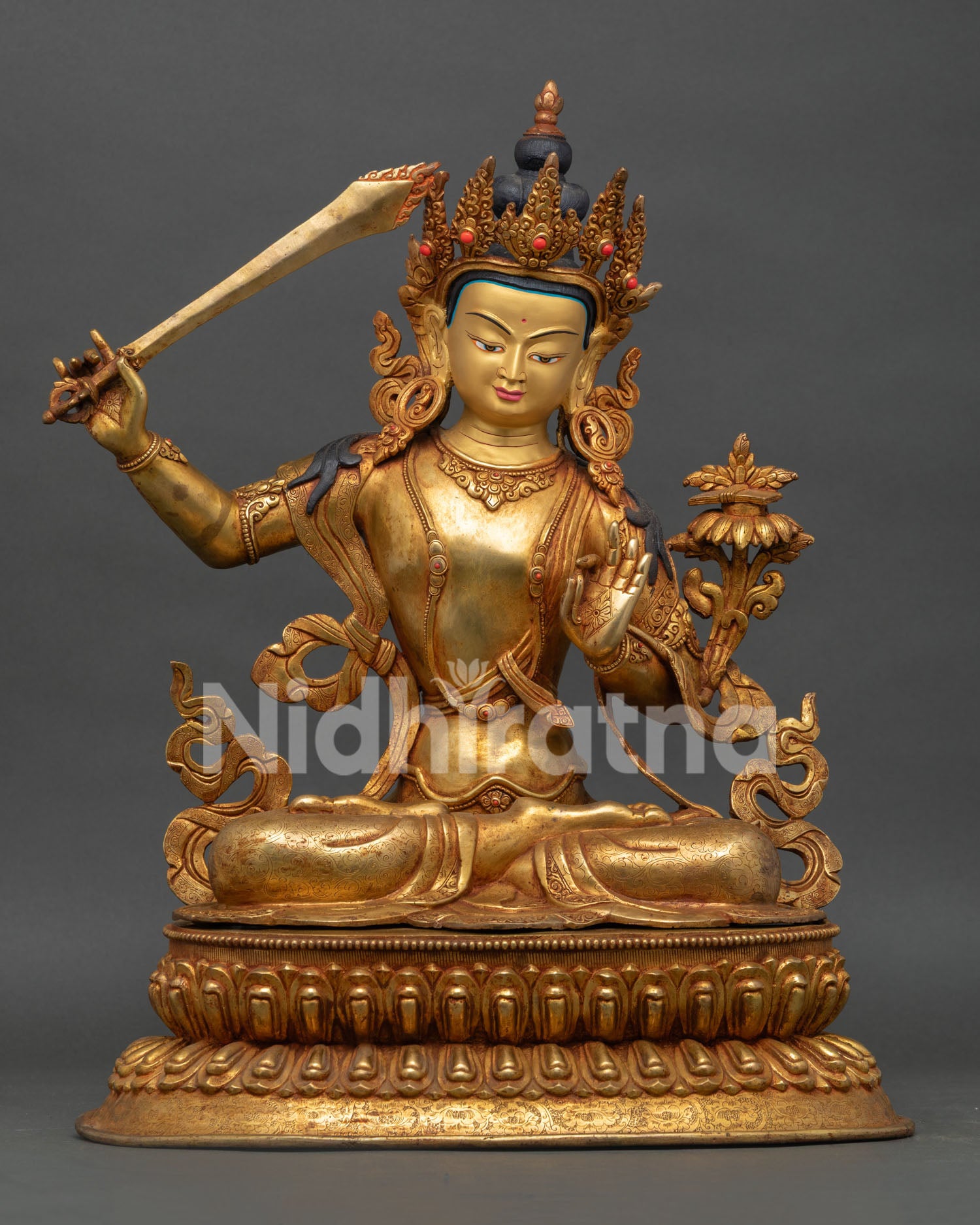Front view of Manjushri Bodhisattva statue with 24K gold gilding and flaming wisdom sword handcrafted in Nepal