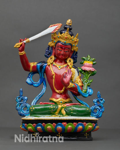 Front view of Manjushri statue handcrafted in Nepal from copper using lost wax technique with hand painted acrylic finish on lotus seat.