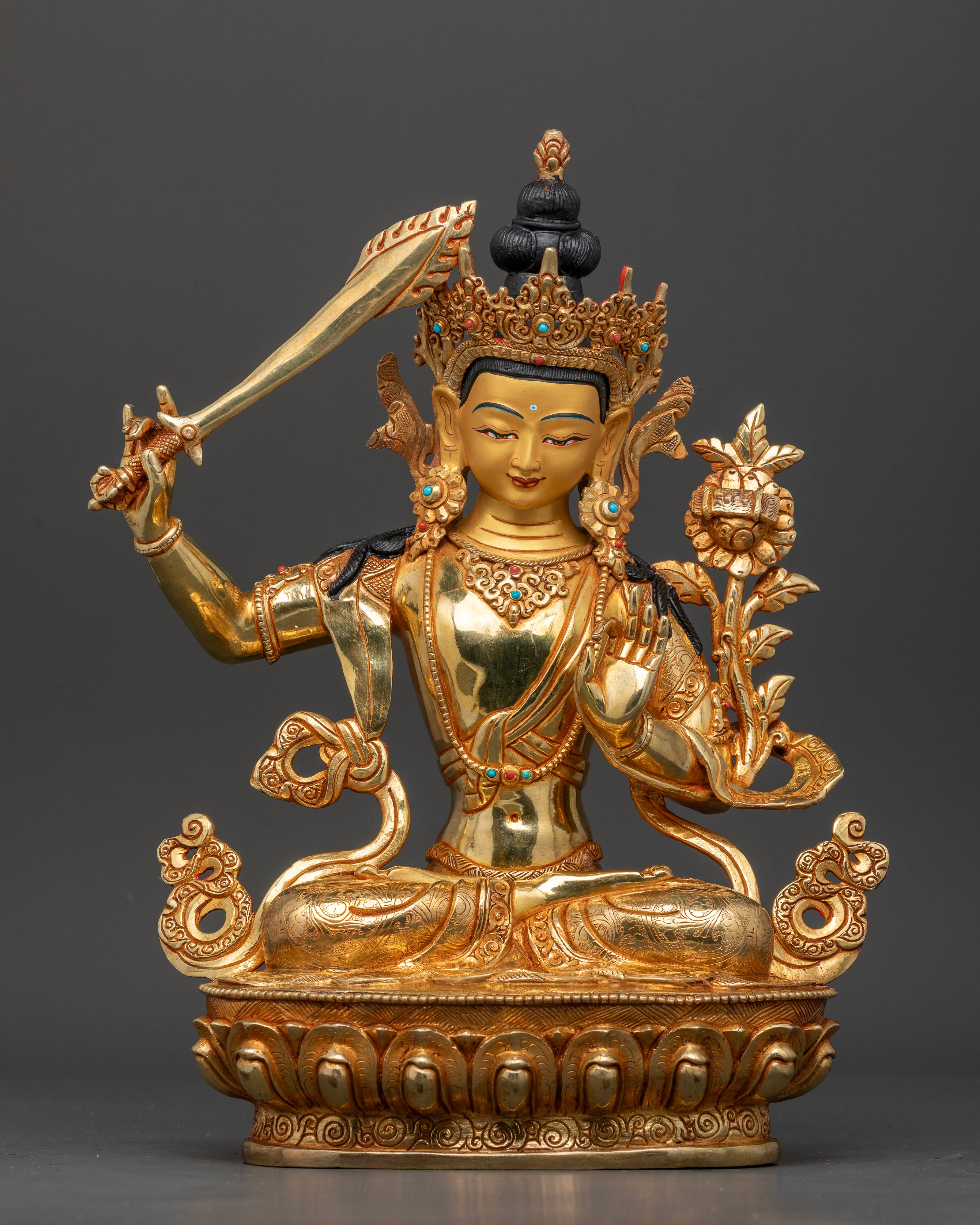 Front view of Manjushri Statue with 24K gold fire gilding, gold-painted face, and semi-precious stone ornaments