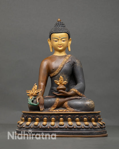 Front view of Medicine Buddha statue handcrafted Nepalese copper sculpture with gold plated accents chemically oxidized finish