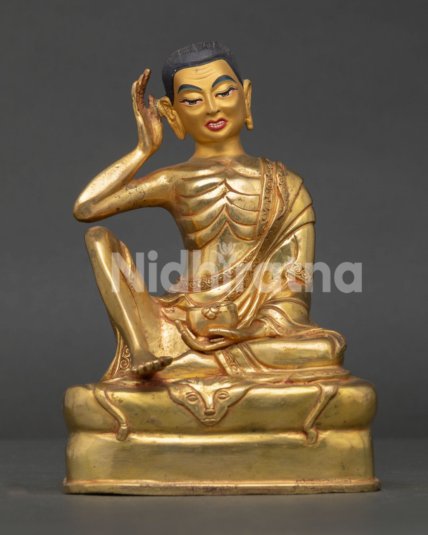 Front View of Milarepa Statue with 24K Gold Gilding on Deer Skin Draped Pedestal