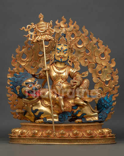 Front view of Namtoshe wealth deity statue seated on snow lion throne with gold gilded finish from Nepal