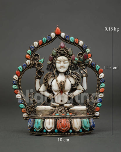 Front view of natural stone Chenrezig statue with gemstone arch, handmade in Nepal