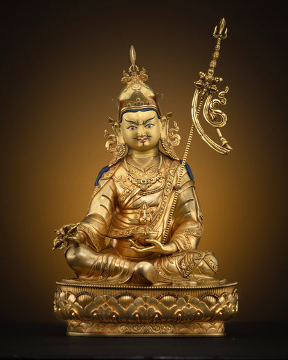 Front view of one of a kind Guru Rinpoche statue with 24K gold gilding and lotus pedestal