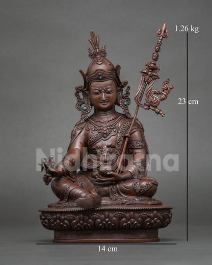 Front view of oxidized copper Guru Rinpoche statue seated on a lotus pedestal