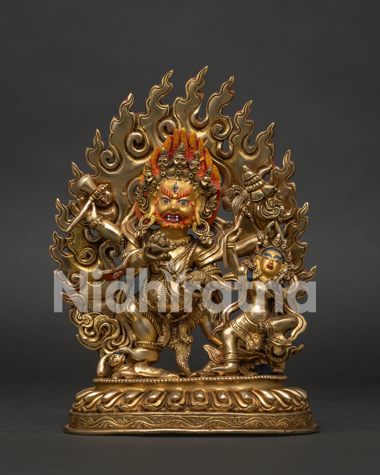 Front view of Red Dzambhala statue with 24K gold plated copper body