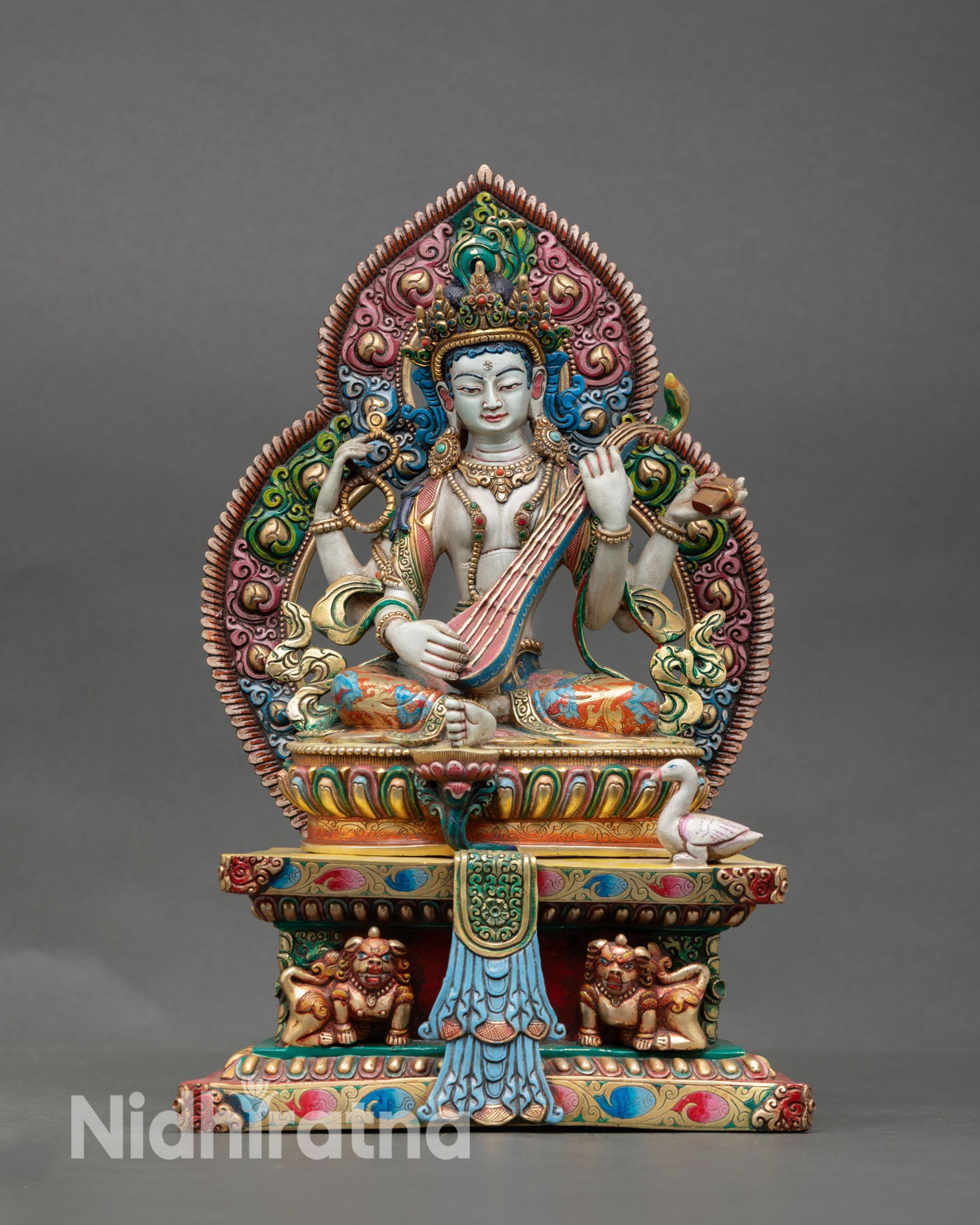 Front view of Saraswati statue handmade Nepal copper sculpture with gold gilded details for meditation and study altar decor