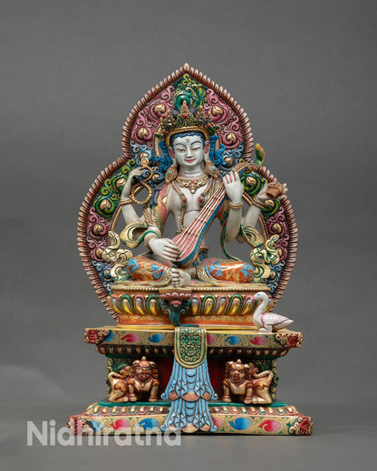 Front view of Saraswati statue handmade Nepal copper sculpture with gold gilded details for meditation and study altar decor