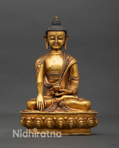 Front view of Shakyamuni Buddha statue antique style copper sculpture with gold gilding and gold painted face handcrafted Newari Buddhist art